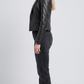 Sleek black leather blazer layered elegantly over a button-down shirt, perfect for transitioning from office to evening events.