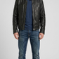 black leather jacket featuring a sleek center zipper and structured classic collar design.