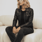 Model wearing a high-quality black genuine leather bomber jacket for a modern streetwear look.