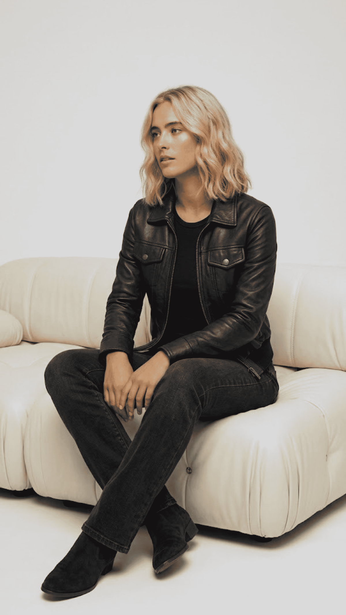 Model wearing a high-quality black genuine leather bomber jacket for a modern streetwear look.