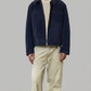 Jackero premium dark navy blue suede bomber jacket featuring structured silver zippers and neat ribbed hem details.