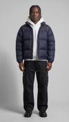 sleek dark navy blue puffer jacket with horizontal quilting design.