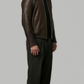 A timeless dark brown smooth leather jacket for minimalist luxury menswear styling and versatile winter outerwear looks.