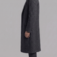 Heavy-duty charcoal grey wool overcoat layered elegantly over a casual sweater, designed for cold weather warmth.
