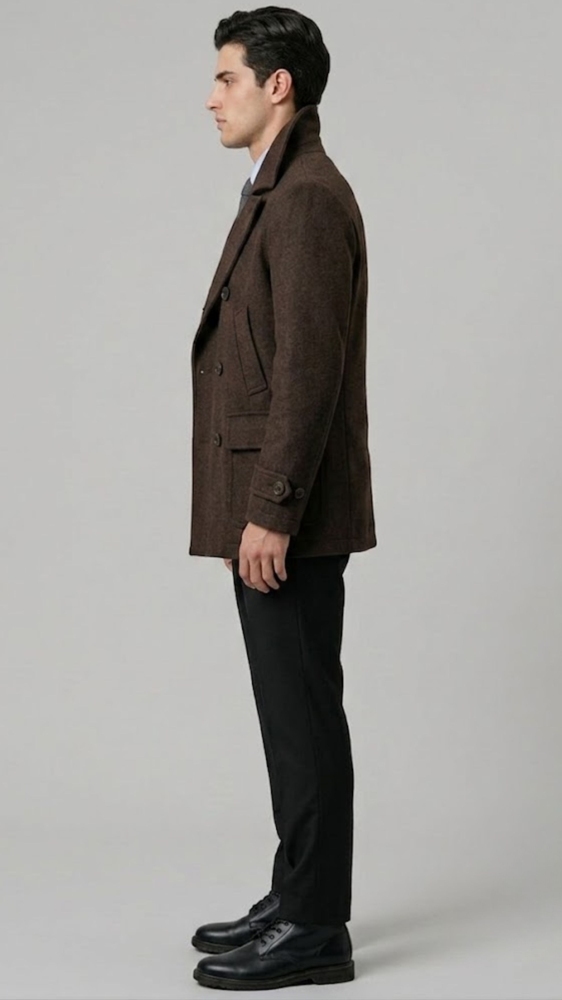 Men's sophisticated winter fashion showcasing a tailored dark chocolate brown wool overcoat for a sharp, formal look.
