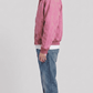 Regular fit blush pink suede jacket displaying the matching elastic waistband and ribbed cuffs for a secure, comfortable fit.