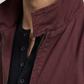 Close up shot of premium lightweight dark burgundy cotton jacket fabric texture