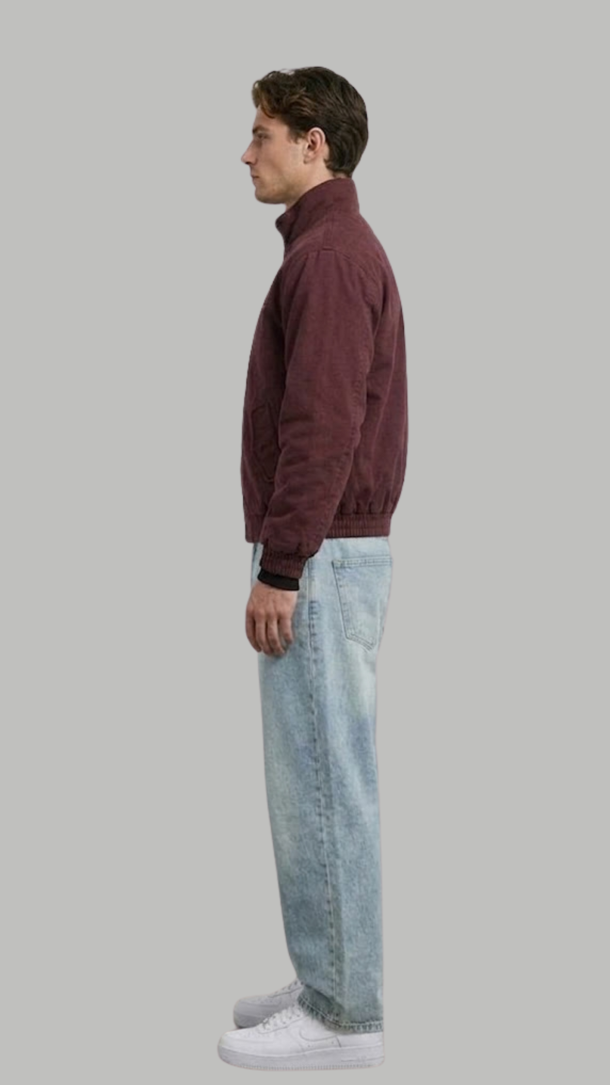 Model posing in a structured deep wine red cotton jacket for a smart casual look