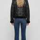 Rear view of the black leather shearling jacket showing the seamless stitching and comfortable heavy winter fit.