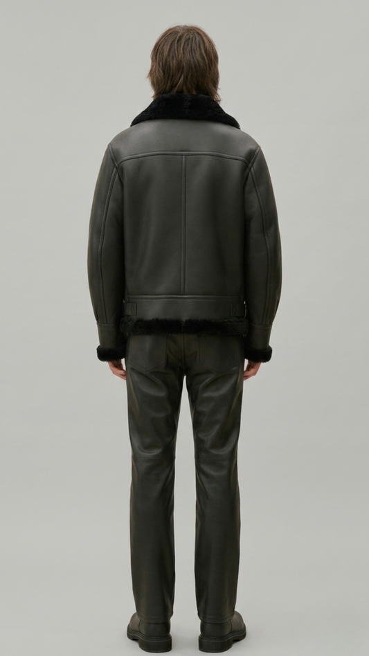 a structured dark black leather winter coat with a prominent shearling neckline.
