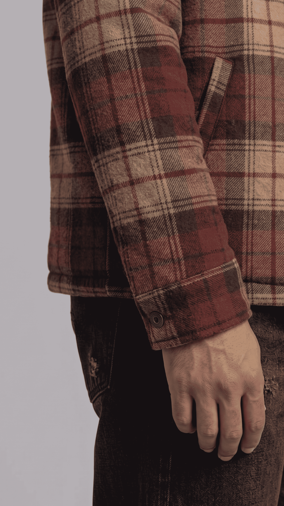 Close-up shot highlighting the soft woven flannel fabric texture with the warm plush inner shearling lining exposed.
