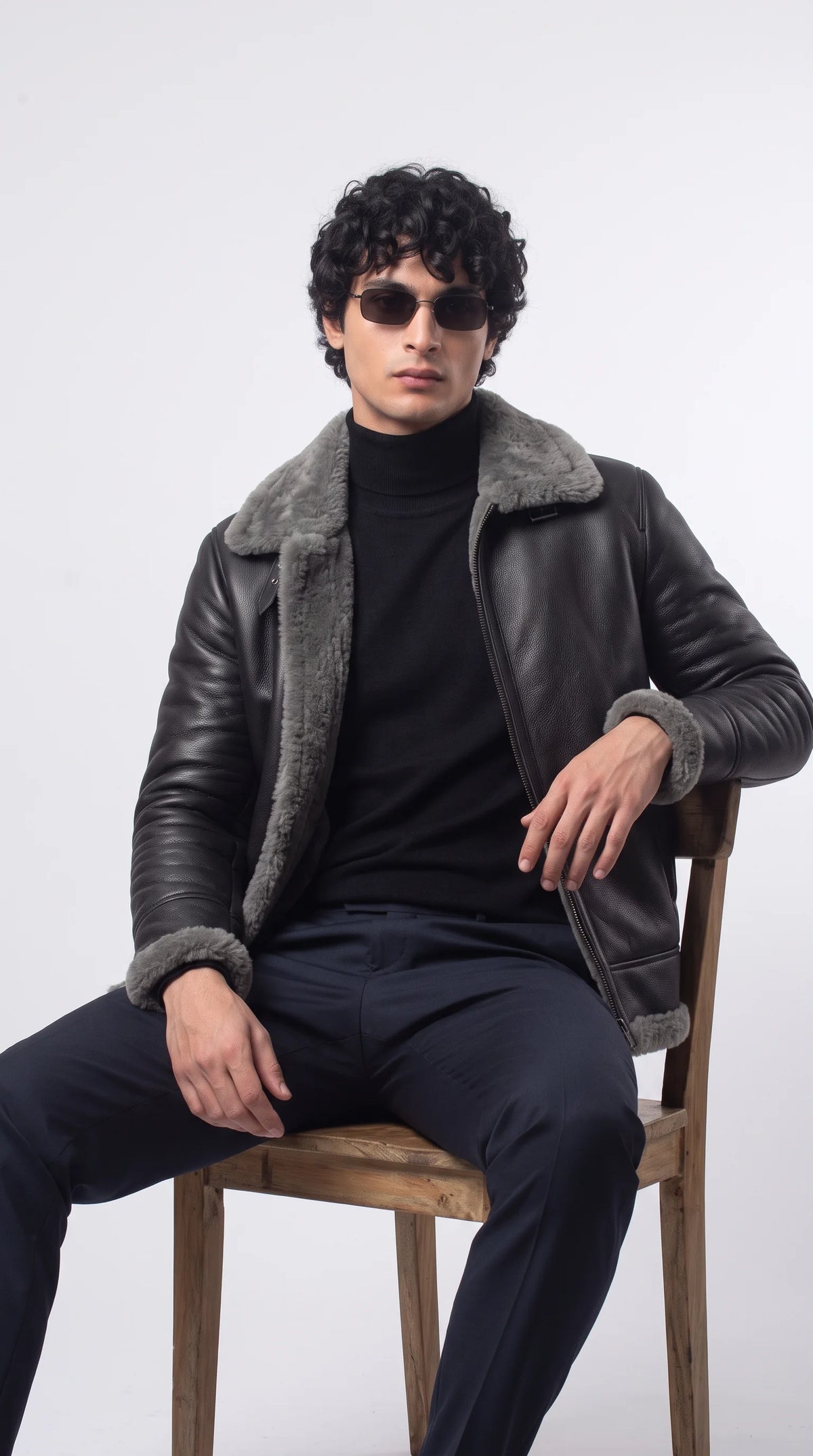 A flawless fusion of vintage grunge and modern luxury, this Jackero black leather and grey fur jacket instantly elevates any casual street style fit into a serious statement ensemble.