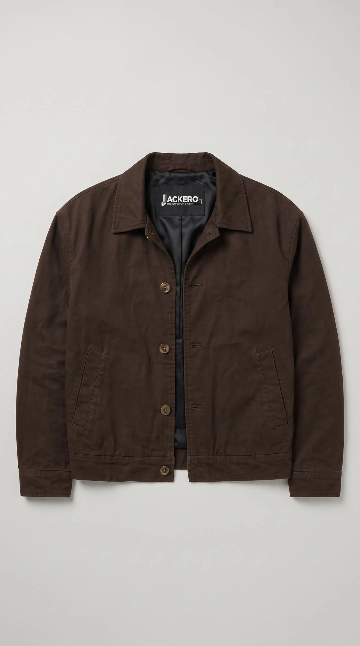 JACKERO dark espresso canvas jacket showcasing antique-finish shank buttons, a structured pointed collar, neat tonal seams and angled waist pockets, with a minimalist design that complements modern heritage-inspired wardrobes.
