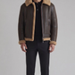 a dark brown leather aviator jacket featuring a rich tan shearling collar.