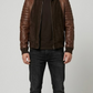 A professional studio front shot of the Jackero dark chocolate brown suede leather jacket, showcasing its rich matte finish and front zip style.