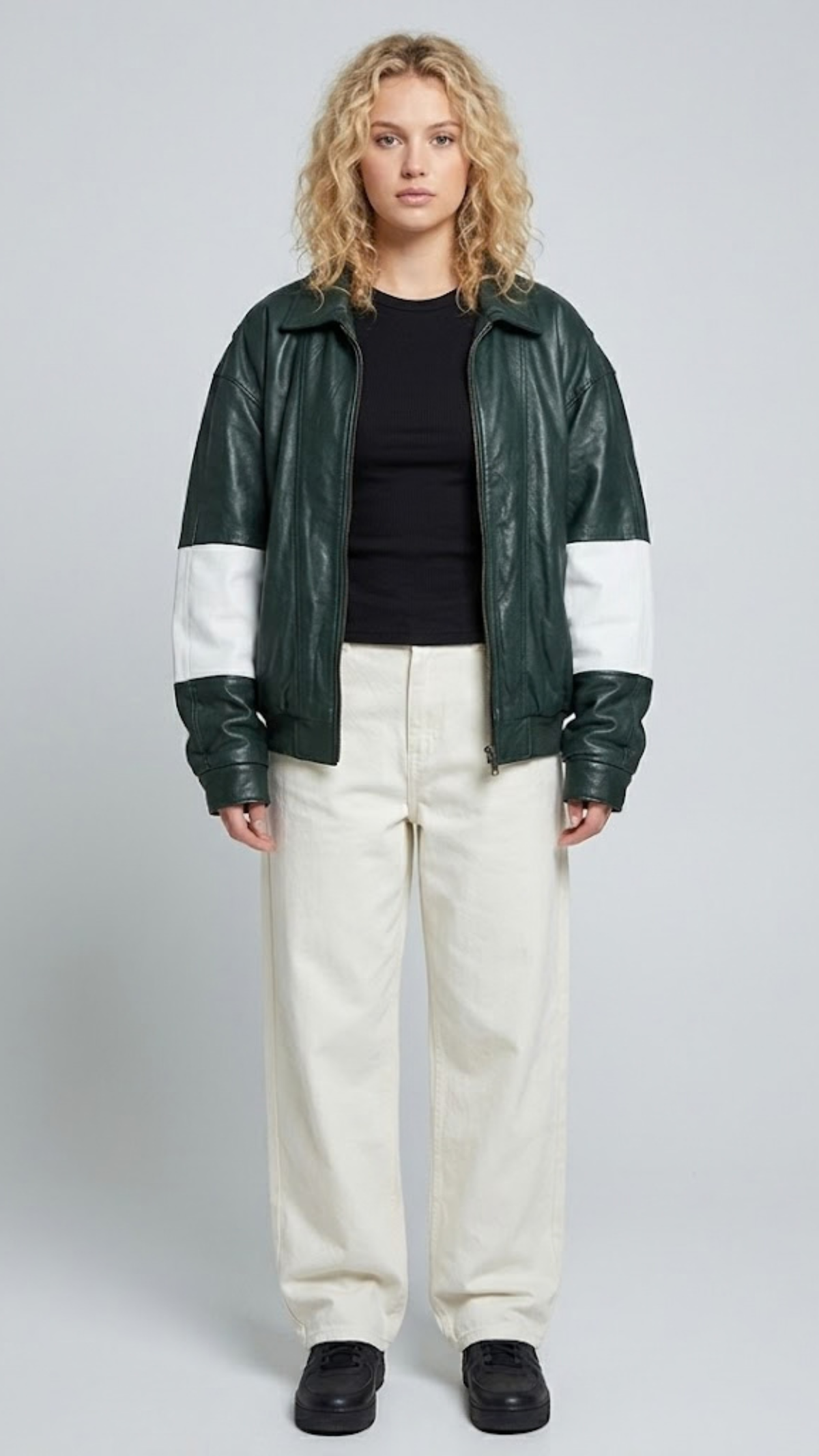 A professional studio front shot of the Jackero dark green oversized leather jacket, featuring bold white stripes along the sleeves and a clean zip-up front.