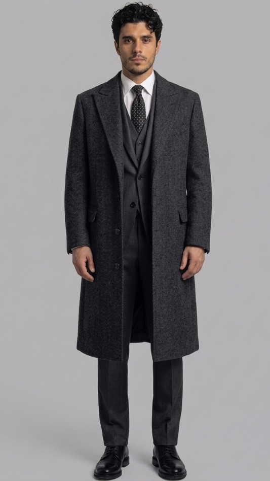 Front full-length view of a premium dark grey wool overcoat featuring structured shoulders and a classic button-down front.