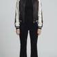A dark navy blue striped silk cotton jacket with a sleek button-up front and neat collar.