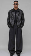 Front full view of a men's darkest black leather baggy jacket showcasing an ultra-deep jet-black shade and clean zip front.