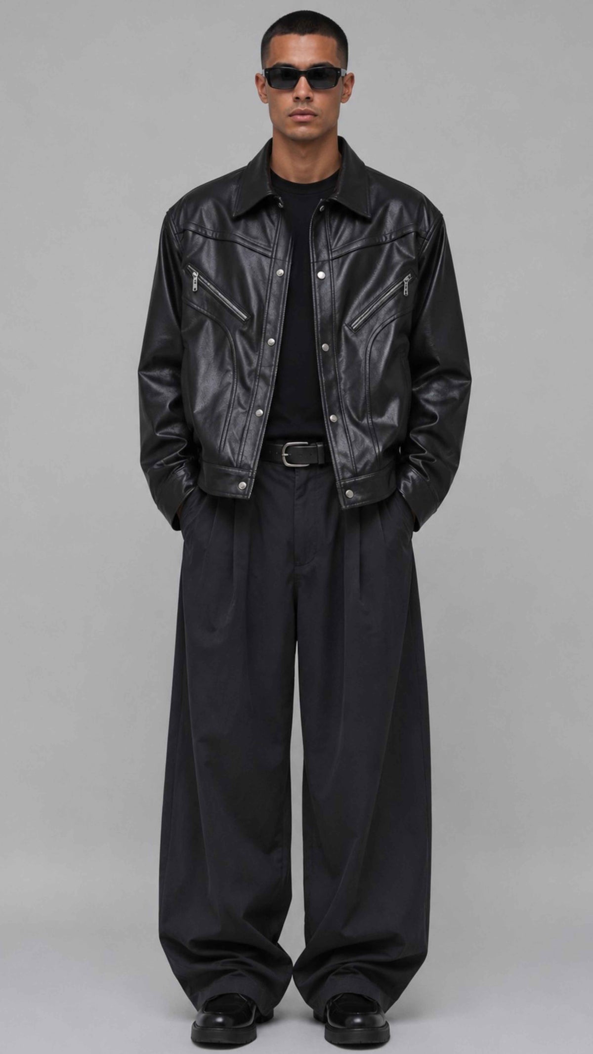Front full view of a men's darkest black leather baggy jacket showcasing an ultra-deep jet-black shade and clean zip front.