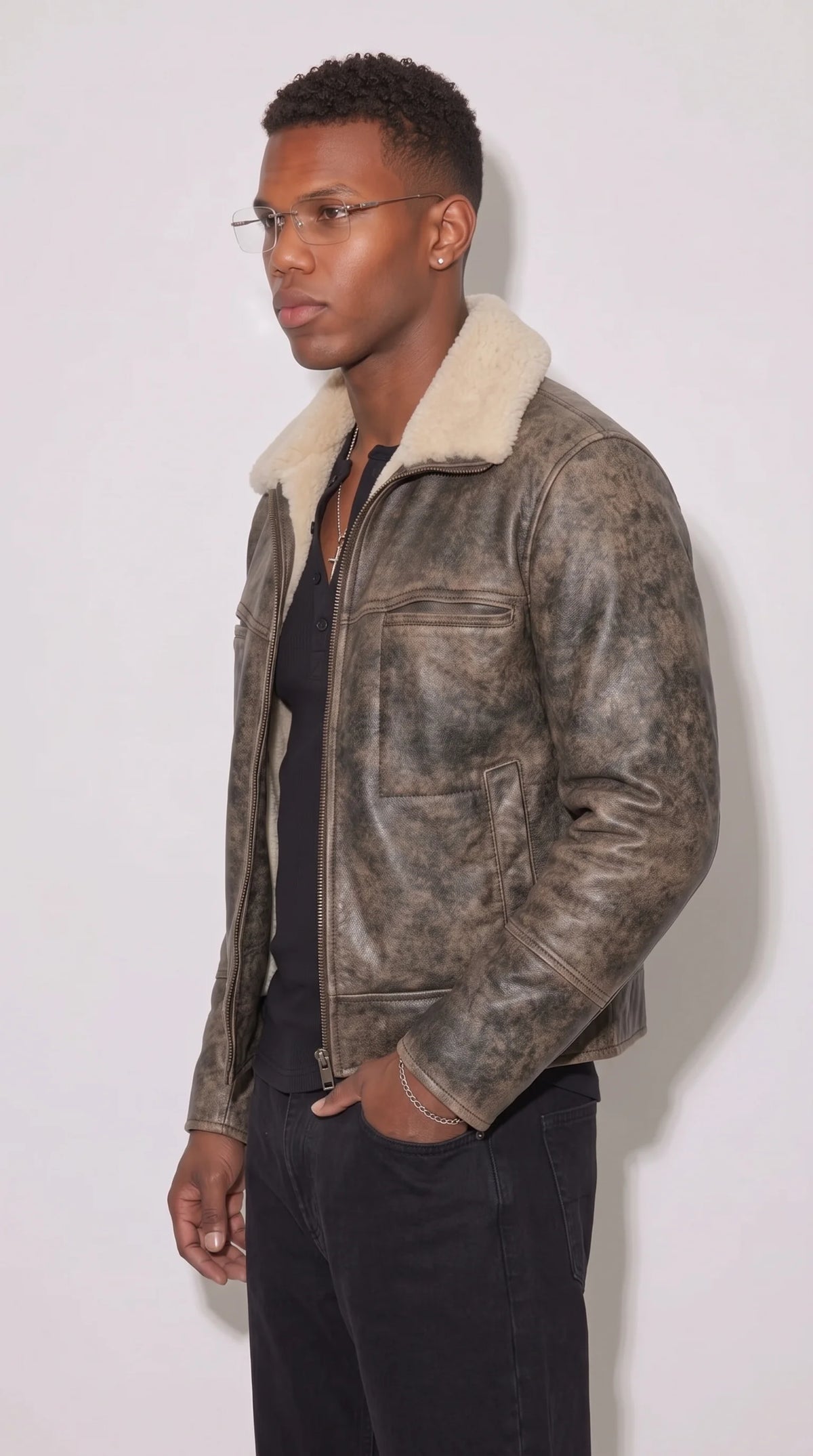 Distressed grey genuine leather flight jacket featuring detailed sleeve zipper hardware, reinforced leather panels, a plush white faux-shearling collar and a rugged multi-tonal finish, combining practical aviator construction with a contemporary cold-weather outerwear look.