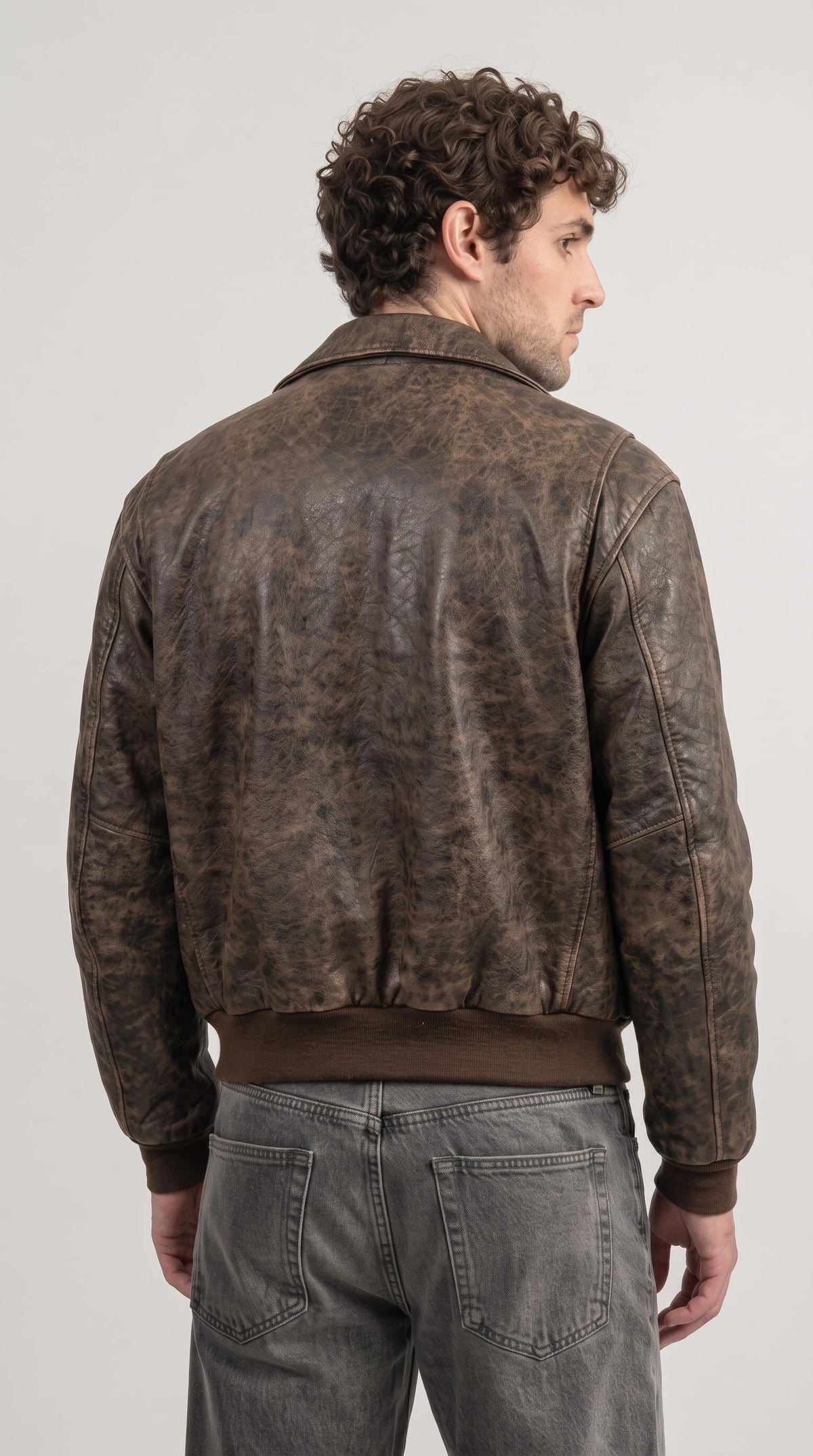 Buy men's antique brown real cowhide leather bomber jacket online, rugged distressed texture, heavy-duty zipper, ribbed knit hem and cuffs, durable and stylish wear for riding and everyday use