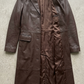Detailed view of the lapels and button design on a high-quality chocolate brown leather overcoat.