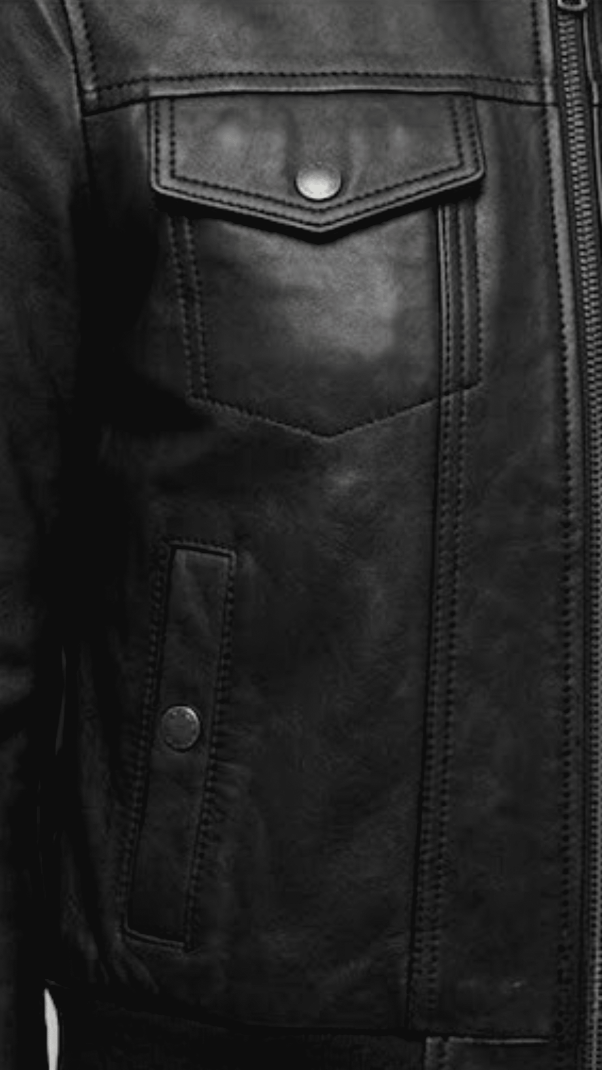 Close-up shot of the premium black leather material and heavy-duty zipper details on the Jackero bomber jacket.