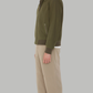 A durable olive green cotton jacket designed for functional everyday wear, combining field-ready utility with a stylish urban aesthetic