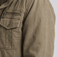 Close-up shot showing the thick, soft white shearling lining inside the high-quality rugged olive cotton fabric.