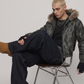 Premium black distressed hooded leather jacket paired with vintage blue boot-cut denim jeans.