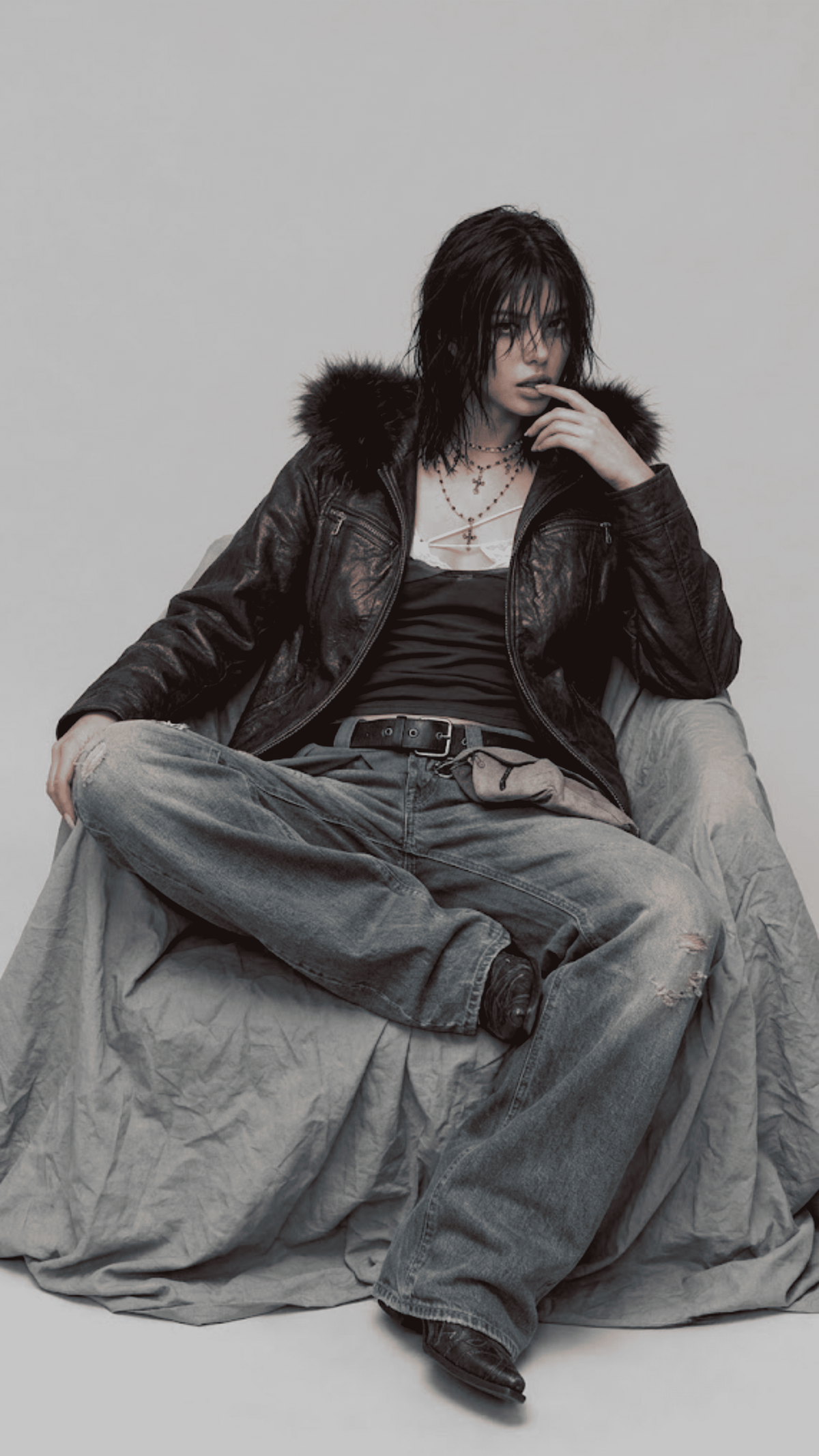 Urban fashion presentation featuring a baggy dark red vine leather jacket accented with black fur, styled for a high-contrast winter outfit.