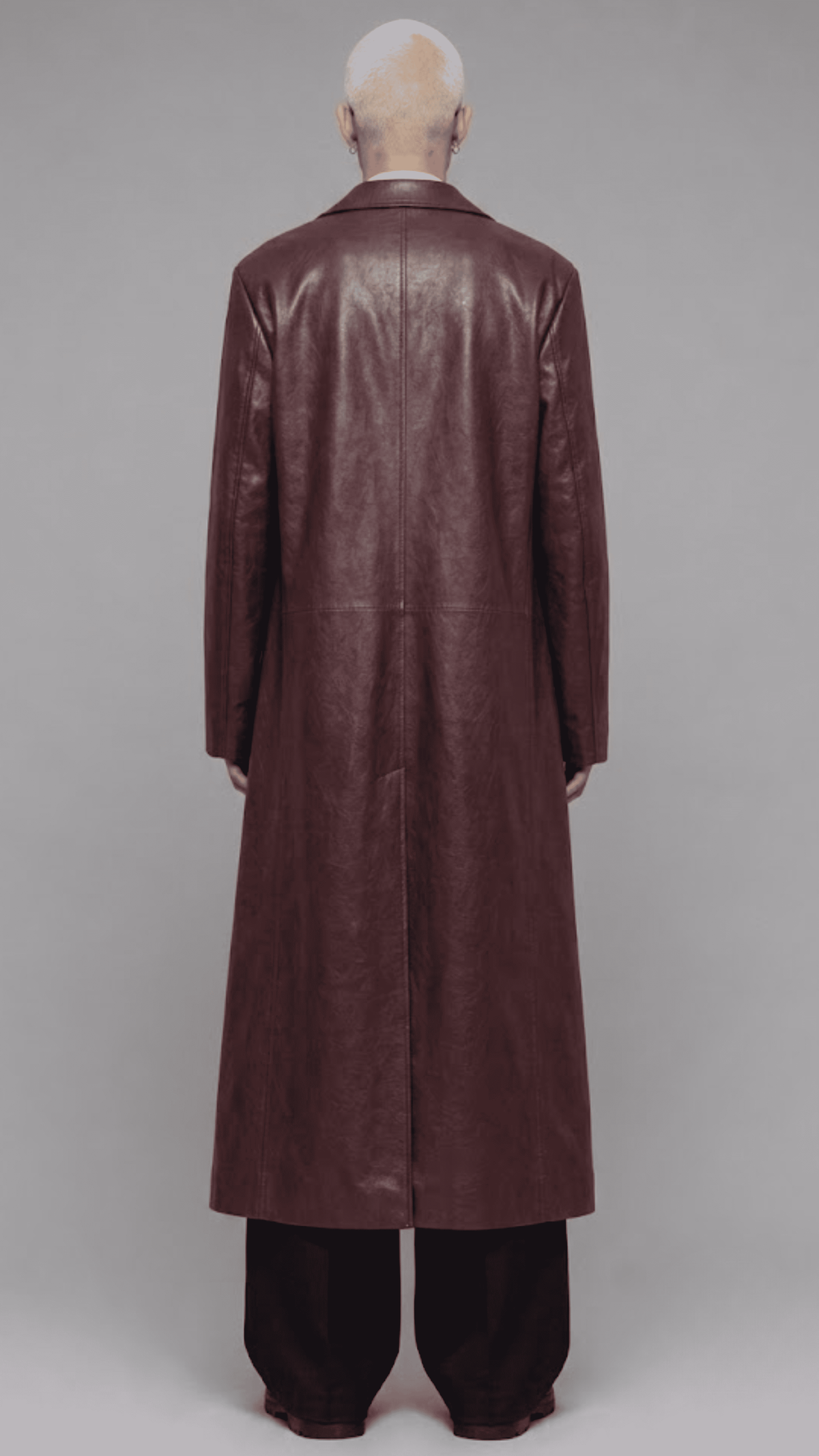 Rear view of men dark red long leather duster showing back vent slit and tailored stitching details