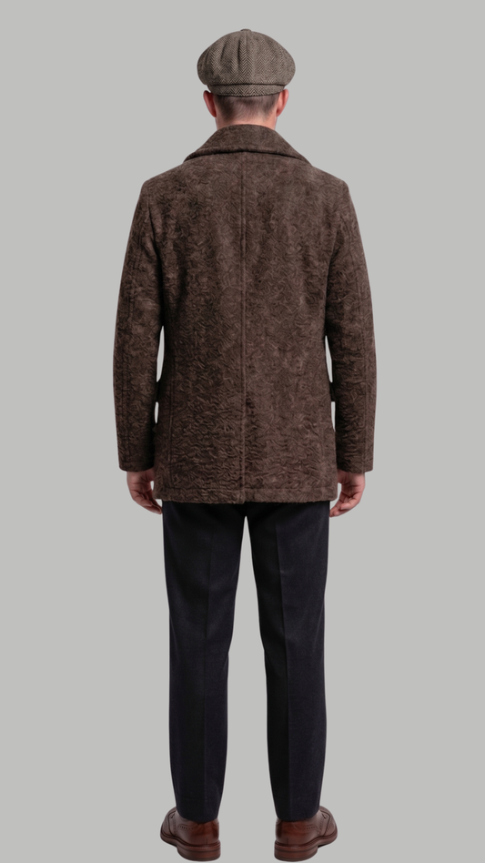 Man wearing a brown coat and cap on a gray background