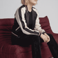 Women's smart-casual fashion featuring a lightweight dark navy blue striped jacket styled for a modern clean look.