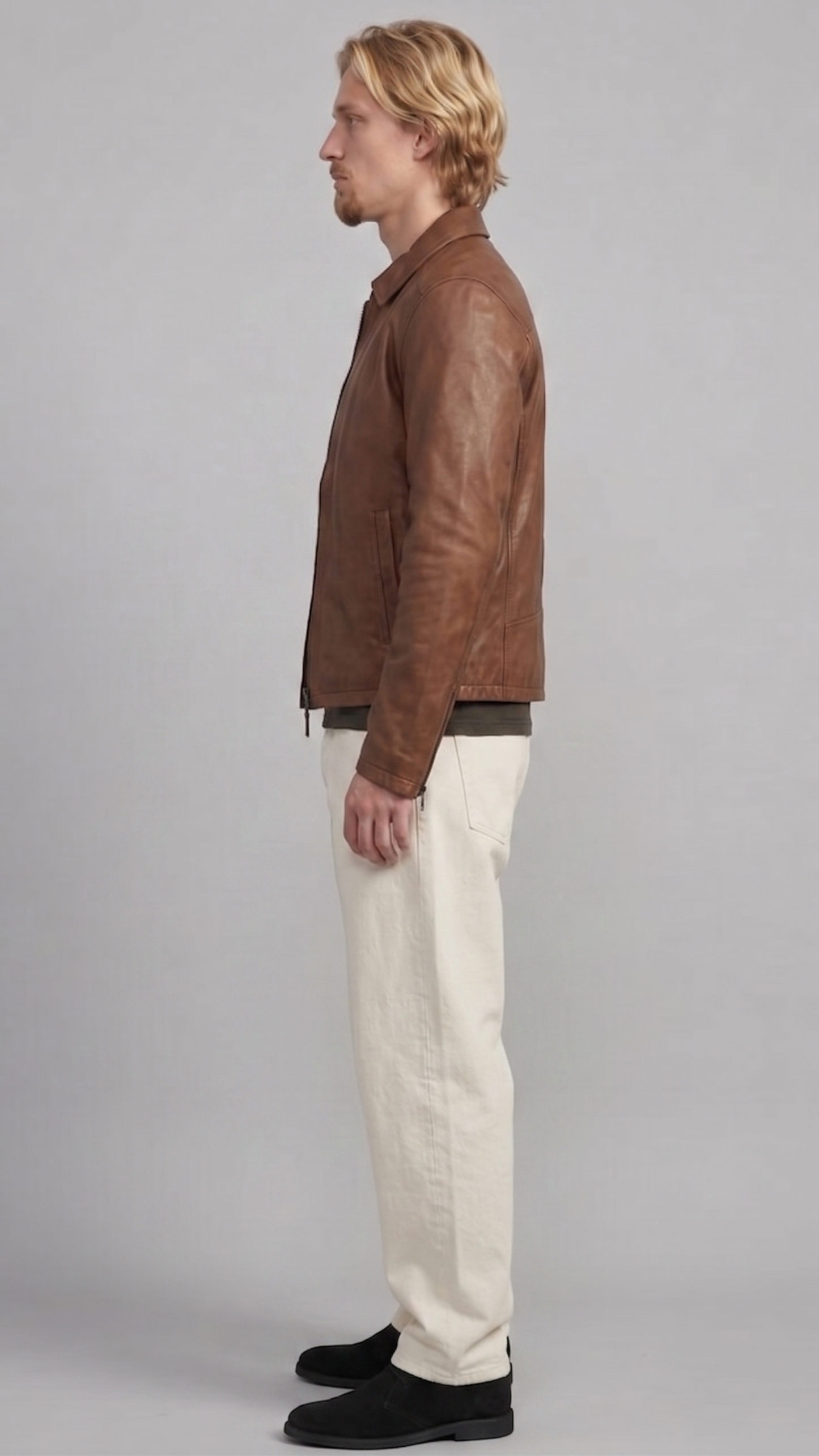 a premium brown leather jacket by Jackero, displaying a warm chocolate shade, clean zipper closure, and classic pocket placement.