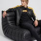 Men's contemporary racing fashion showcasing a structured yellow, black, and white leather biker jacket with speed stripes.