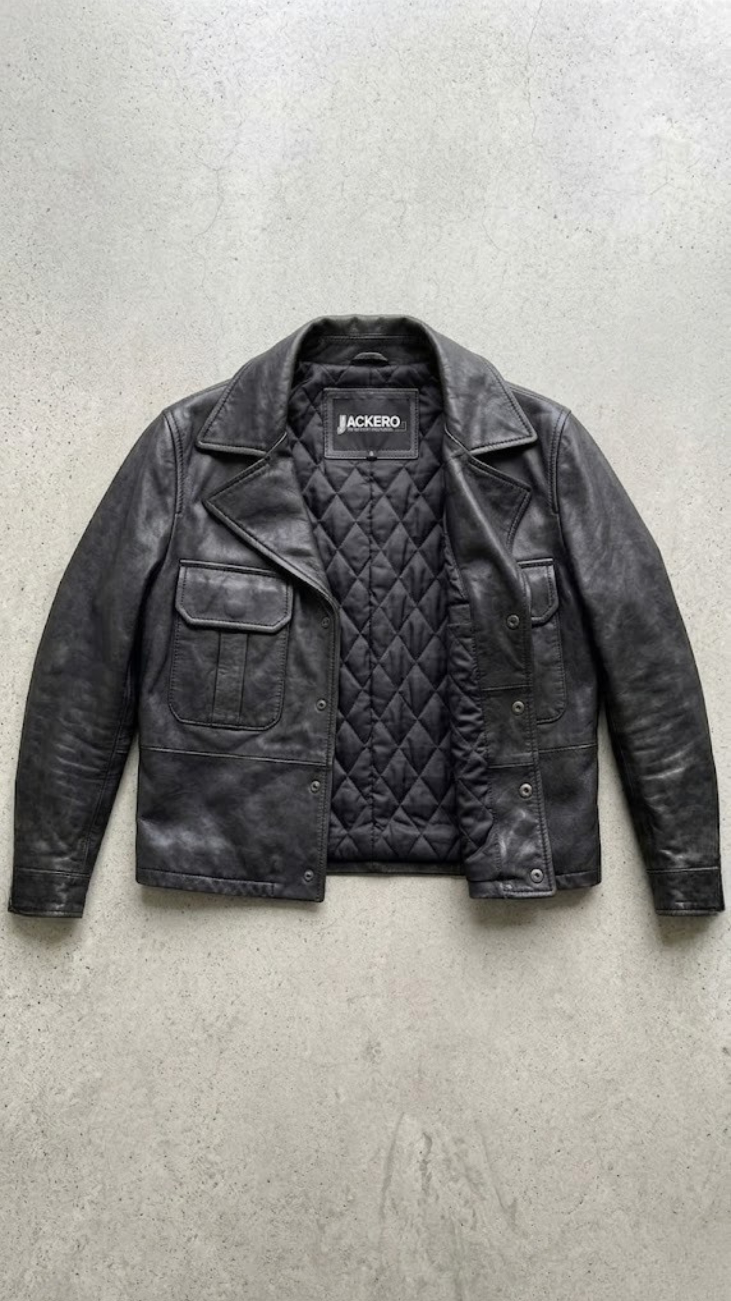 the fine craftsmanship, durable stitching, and high-quality leather texture on a black Jackero jacket.