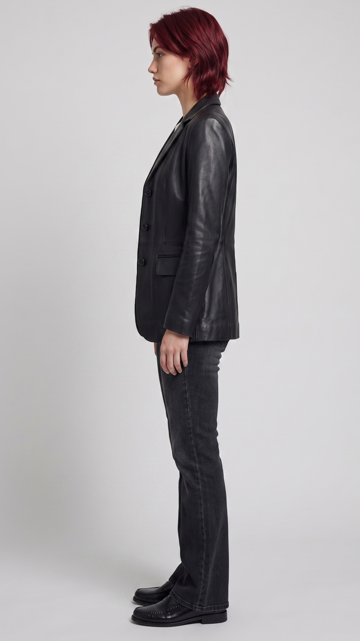 Sophisticated ladies' black leather blazer styled over a casual top, perfect for transitioning from office wear to a night out.