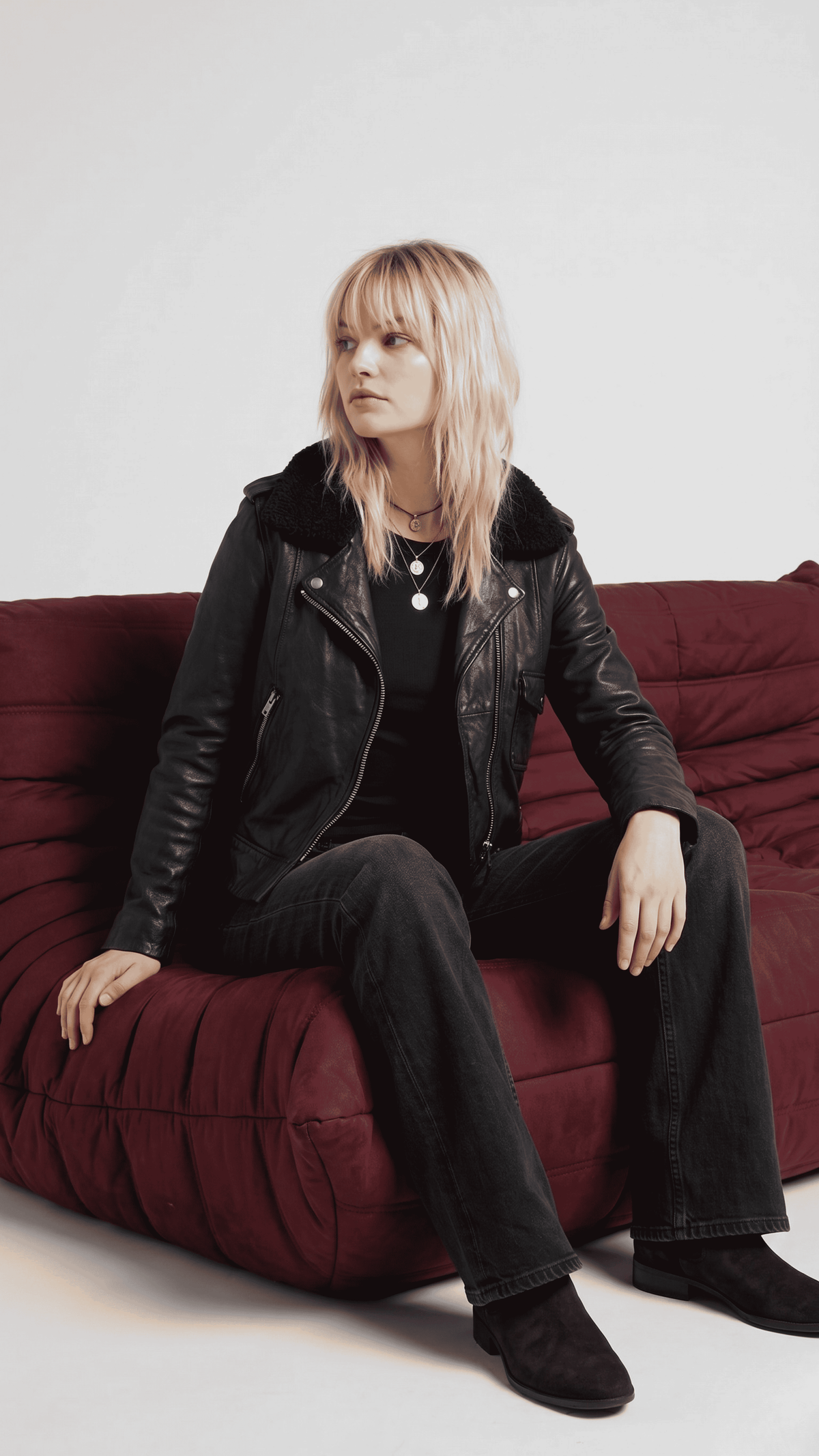 High-fashion urban lifestyle showcase featuring an elite premium black leather moto jacket, styled perfectly for a luxury aesthetic.
