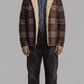 Jackero flannel checked shearling jacket showing the classic plaid pattern and thick white fur collar.