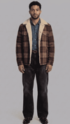 Jackero flannel checked shearling jacket showing the classic plaid pattern and thick white fur collar.