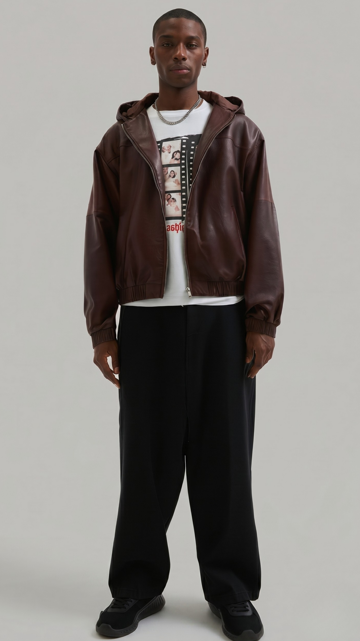 Premium dark maroon leather bomber jacket with an adjustable drawstring hood, featuring front zip closure and ribbed cuffs by Jackero.