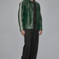 Man wearing a green leather jacket with white stripes on a gray background