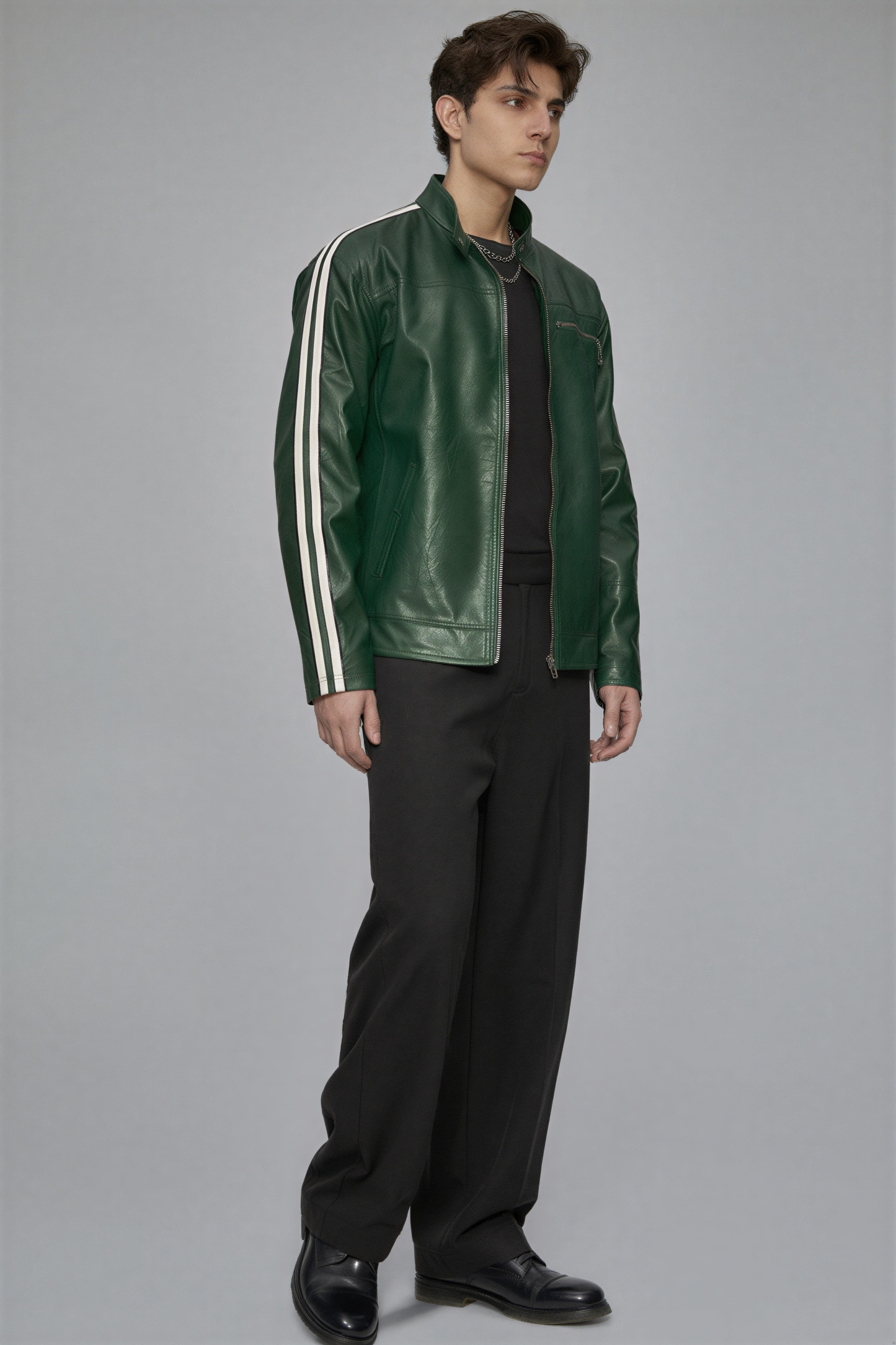 Man wearing a green leather jacket with white stripes on a gray background