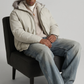 Studio photography of a model in a clean white puffer jacket, perfect for cold winter days.