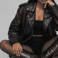 Contemporary street fashion presentation featuring an oversized black aviator jacket styled for an edgy, modern flight-inspired outfit.