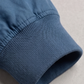 Close-up shot showcasing the subtle luxury sheen of the high-quality cyan silk cotton blend fabric and precise stitching lines.