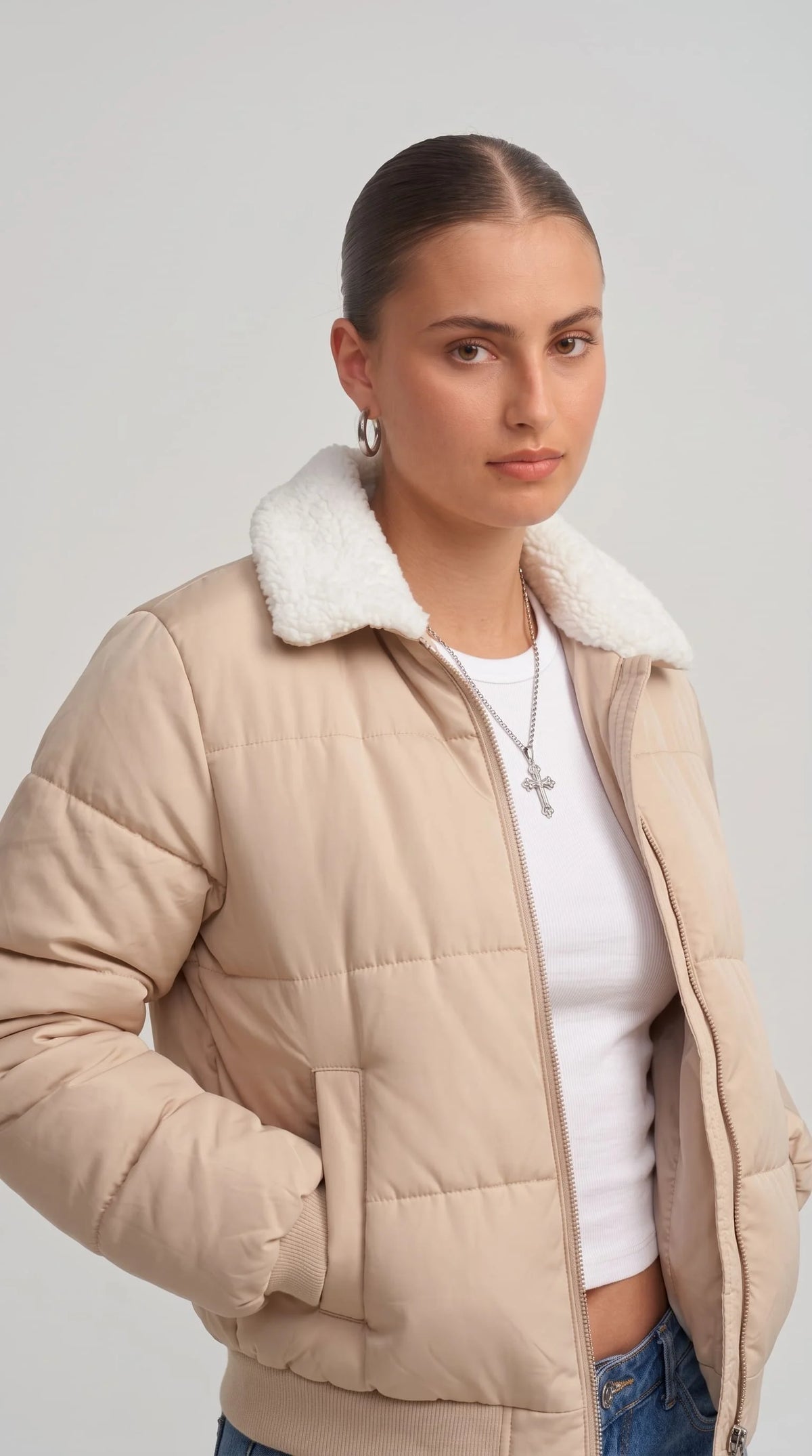 Close-up shot showcasing the delicate weave, soft cream texture, and luxury premium sheen of a high-quality light beige silk cotton blend fabric.