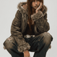 Contemporary urban fashion presentation featuring a baggy dark green suede jacket accented with fur, styled for a vintage 2000s outfit.